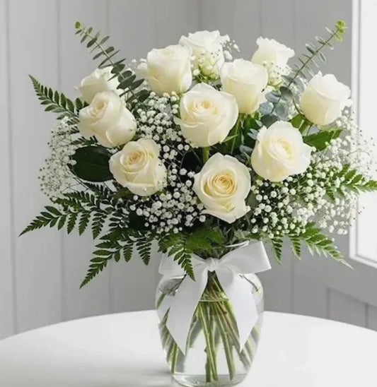 Dozen white roses in a vase