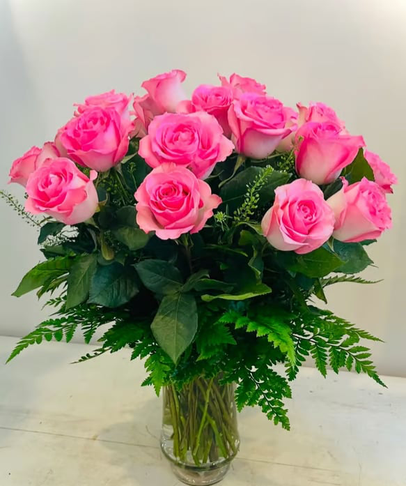 12 pink roses in a vase