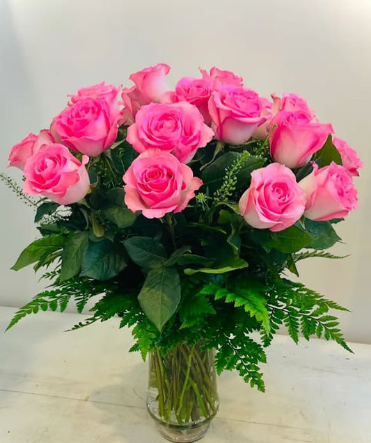 12 pink roses in a vase